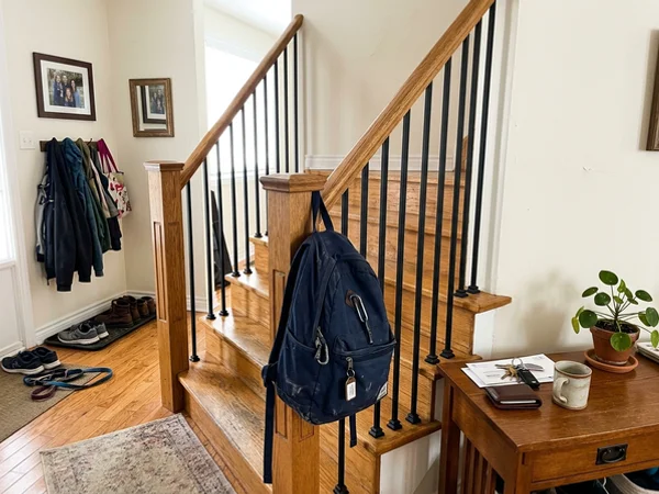 Same foyer staircase after iron baluster replacement