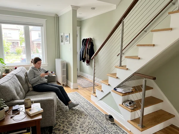 Same stair after a horizontal cable railing replaced the half wall