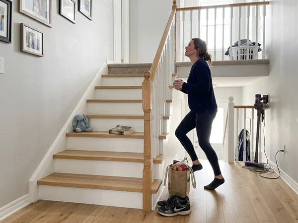 Same staircase after white oak recapping with white risers