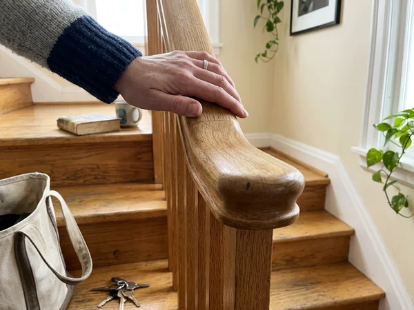 Close-up of a graspable oak handrail profile