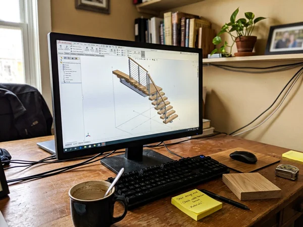 3D render of an L-shaped open-riser staircase during design review
