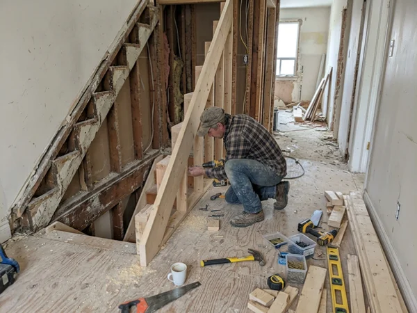 Straight stair opened up during demolition with a new carriage being fitted